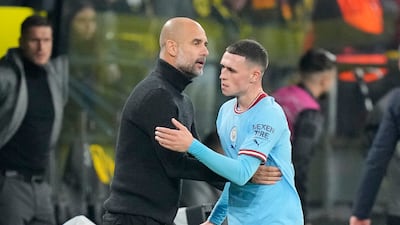 City coach Pep Guardiola greets Phil Foden after he was substituted. AP