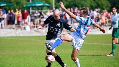 Gulf Legends (dark blue) v Airbus (light blue stripes) during Day 1 of the Emirates Airlines Dubai Rugby Sevens at The Sevens in Dubai on Thursday. Victor Besa for The National
