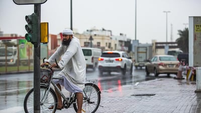 Scattered showers are forecast in parts of the country for the next few days. Victor Besa / The National
