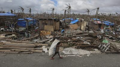 A Filipino typhoon victim in the typhoon devastated town of Guiuan, Samar Island. Typhoon Haiyan destroyed more than a million houses and has killed around 4,000 people. EPA
