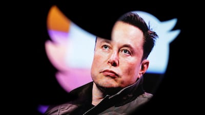 Elon Musk's photo is seen through a Twitter logo. Reuters