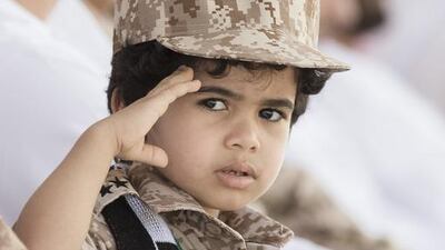A young guest at the ceremony. Philip Cheung for Crown Prince Court - Abu Dhabi