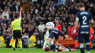 Referee Alejandro Quintero shows a red card to Real Madrid's Fran Garcia. Getty Images