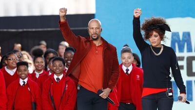 Common and Andra Day perform with the Cardinal Shehan Choir at a rally in Washington. Reuters