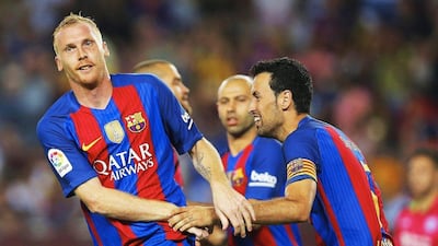 Jeremy Mathieu celebrates with Sergio Busquets after scoring the equalising goal. Alejandro Garcia / EPA