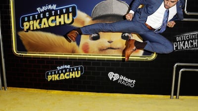 Mexican actor Omar Chaparro does a martial arts kick at the US premiere of the film Pokemon Detective Pikachu in New York. EPA