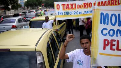 In Rio de Janeiro, taxi drivers staged a rally and partial road blockage a day before the city plays host of the Fifa World Cup. Joe Raedle / Getty Images