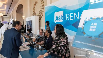 Visitors attend the Irena conference in Abu Dhabi on Sunday. Antonie Robertson / The National