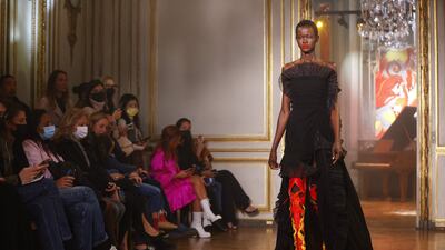 A model presents a creation from the Rochas spring/summer 2022 collection. AFP