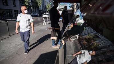 An Algerian man wearing an Algerian national soccer team yersey walks next to an Arabic butcher shop in Arabic markets in Porte de Montreuil area in Paris, France. The majority of the residents around Porte de Montreuil area in Paris are Arab Muslims from North Africa. Adherents of Islam across France were unable to take part in the habitual collective prayers this year, as mosques have closed down due to the ongoing pandemic of the COVID-19 disease caused by the SARS-CoV-2 coronavirus. Muslims around the world celebrate the holy month of Ramadan by praying during the night time and abstaining from eating, drinking, and engaging in sexual acts between sunrise and sunset. Ramadan is the ninth month in the Islamic calendar and it is believed that the revelation of the first verse in the Koran occurred during its last 10 nights. EPA