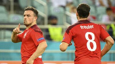 Switzerland's midfielder Xherdan Shaqiri celebrates his first goal in a 3-1 win over Turkey. EPA