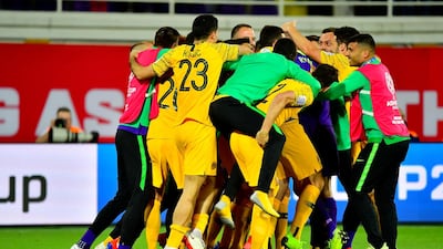 Australia players celebrate their 4-2 penalty shoot-out victory over Uzbekistan to reach the quarter-finals of the 2019 Asian Cup at the Khalifa bin Zayed Stadium in Al Ain. AFP
