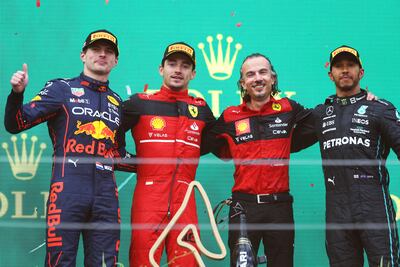 Austrian Grand Prix winner Charles Leclerc of Ferrari, second-placed Max Verstappen of Red Bull and third-placed Lewis Hamilton of Mercedes with Laurent Mekies, Scuderia Ferrari Sporting Director, on the podium on July 10, 2022 in Spielberg, Austria. Getty