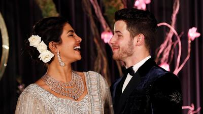 Newlyweds Priyanka Chopra, 36, and Nick Jonas, 26, pose for a photograph during a reception at a hotel in New Delhi on December 4, 2018. Photo: Reuters