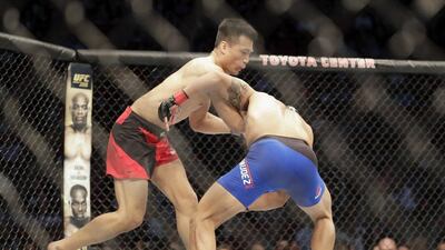 Chan Sung Jung of South Korea fights Dennis Bermudez in the first round of their featherweight bout during the UFC Fight Night event at the Toyota Center on February 4, 2017 in Houston, Texas. Tim Warner / Getty Images