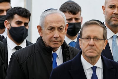 Israeli Prime Minister Benjamin Netanyahu, centre, and President Isaac Herzog attend the memorial service. Reuters