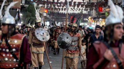 Shia Muslim historical re-enactors attend a procession commemorating the arrival of Imam Hussein, his family, and companions to the Iraqi holy city of Karbala, ahead of the Muharram season of mourning in Baghdad. AFP
