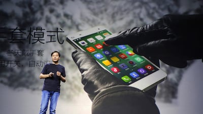 Lei Jun, founder and chief executive officer of China's mobile company Xiaomi, introduces the new features of Xiaomi Phone 4 at its launching ceremony in Beijing on July 22, 2014. Jason Lee / Reuters