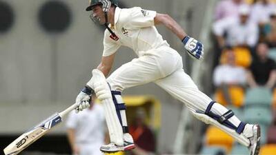 Australian batsman Michael Hussey completes a run during the second day of the first Ashes cricket Test match between Australia and England at the Gabba in Brisbane.