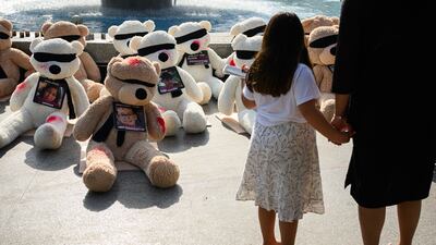 In Tel Aviv, teddy bears with their eyes covered and signs of injury go on show to highlight the young children and babies missing, believed to be being held by Hamas. Getty