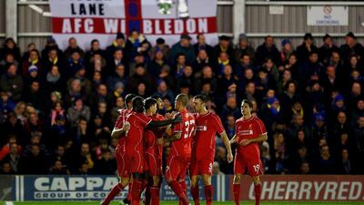 Steven Gerrard celebrates with Liverpool teammates after scoring the winning goal on Monday night against AFC Wimbledon in the FA Cup. Julian Finney / Getty Images