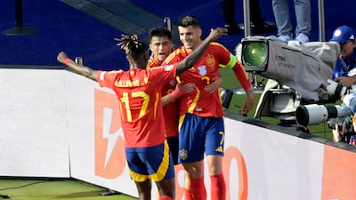 Spain's Alvaro Morata celebrates scoring their first goal with Pedri and Nico Williams. Reuters