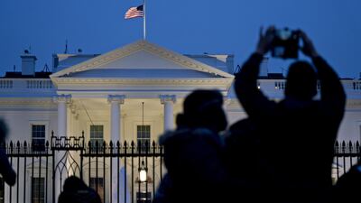 A visitor takes a photograph outside the White House. President Donald Trump has threatened to close the US-Mexico border amid a partial federal government shutdown that appears likely to stretch into 2019. Bloomberg