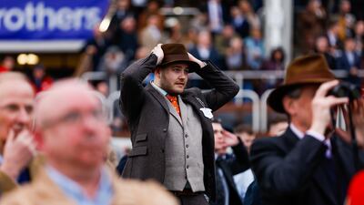 A racegoer during the Ukraine Appeal National Hunt Challenge Cup Amateur Jockeys' Novices' Chase. PA