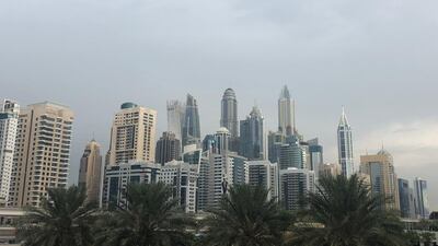Dark clouds over Dubai Marina on Wednesday morning. Chris Whiteoak / The National