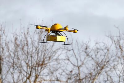 A quadcopter drone arrives with a small delivery at Deutsche Post headquarters in 2013 in Germany. Getty Images