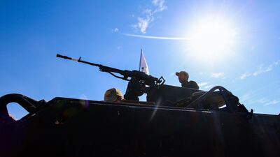 Tanks are stationed in the desert.
