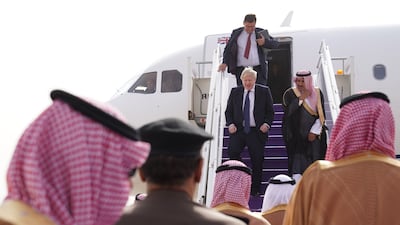 Boris Johnson walks down the steps of his plane as he arrives at Riyadh Airport, Saudi Arabia