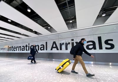 Travellers arrive at Heathrow Airport in London. Reuters