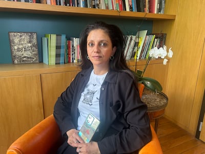 Maha Al-Daya holds a leaflet dropped from Israeli planes to Gazans with eviction instructions. Sunniva Rose / The National