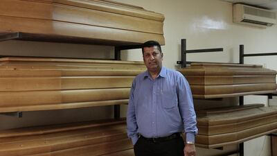 John Korah, Managing Director of Grafco, takes care of cadavers in coffins to be ship out or airlifted to any country of origin. Jeffrey E Biteng / The National