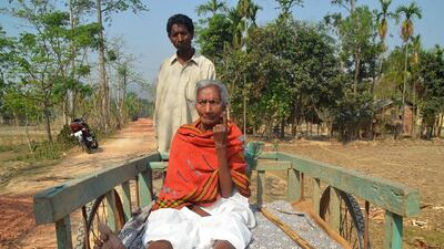 An Indian woman voter sits on her son’s cart after casting her vote at a polling station at Borkok, in Karbianglong district, about 250 kilometres east of Guwahati, capital of northeastern Assam state during the fourth phase of the Lok Sabha (lower house) elections. Anuwar Hazarika / AFP