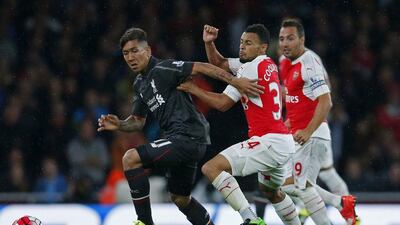 Francis Coquelin, centre, has established himself as Arsenal’s first-choice defensive midfielder. Eddie Keogh / Reuters