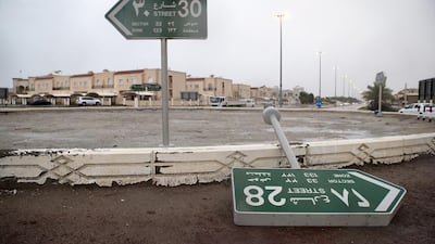 Gusts from Wednesday's storm were strong enough to topple street signs in Khalifa City. Christopher Pike / The National