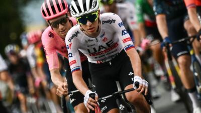 UAE Team Emirates rider Tadej Pogacar cycles with the peloton during the race. AFP