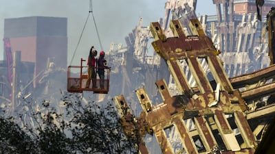 Workmen begin dismantling the destroyed remains of the World Trade Centre on September 17, 2001. EPA