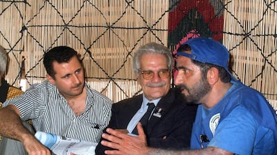 Sheikh Mohammed bin Rashid, then Defence Minister, chats with Egyptian actor Omar Sharif and Bashar Al Assad, now President of Syria, in a tent in the historic city of Palmyra, north east of Damascus, Syria, in 1999. AFP