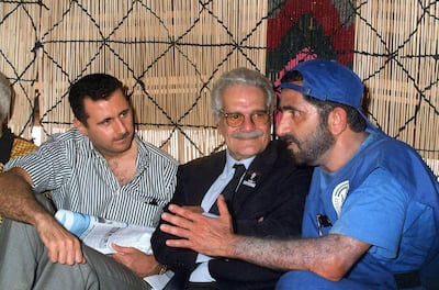 Sheikh Mohammed bin Rashid, then Defence Minister, chats with Egyptian actor Omar Sharif and Bashar Al Assad, now president of Syria, in a tent in the historic city of Palmyra, Syria, in 1999. AFP