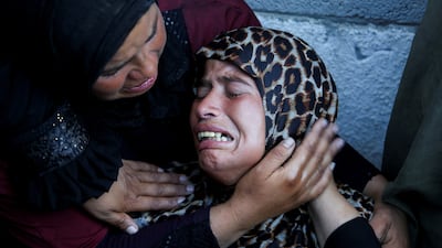 Palestinians mourn relatives killed in overnight Israeli attacks on Gaza, at Nasser Hospital in Khan Younis. Reuters