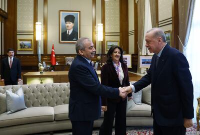 Turkish President Recep Tayyip Erdogan meets Sirri Sureyya Onder, left, and Pervin Buldan, centre, of the pro-Kurdish Equality and Democracy Party, in Ankara this month. Turkish Presidential Press Service/AFP