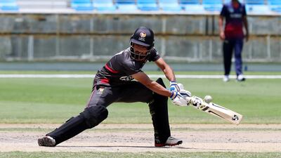 Osama Hassan Shah looks to get a shot away for the UAE.