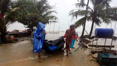 Locals clear the shoreline in preparation for the approaching Tropical Storm Pabuk, in Pak Phanang, in the southern province of Nakhon Si Thammarat, southern Thailand. AP Photo