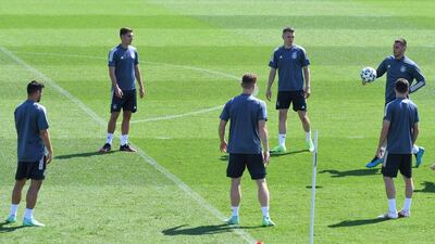 Left to right: Kevin Volland, Florian Neuhaus, Marcel Halstenberg, Matthias Ginter, Jonas Hoffmann and Niklas Suele warm-up for training. AFP
