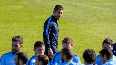 Diego Simeone examines his squad as he conducts a team training session on Tuesday ahead of their Wednesday Champions League match against Juventus in Madrid. Dani Pozo / AFP / September 30, 2014