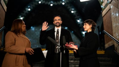 Zohran Mamdani stands with his wife Rama Duwaji, right, and New York Attorney General Letitia James as he is sworn in as New York's first Muslim Mayor. Reuters