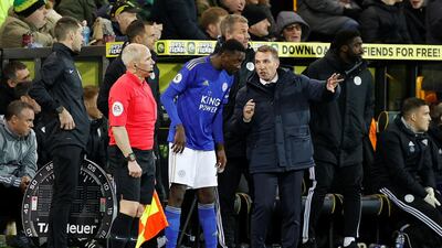 Leciester manager Brendan Rodgers, right, talks to substitute Wilfred Ndidi before the midfielder's introduction. Reuters